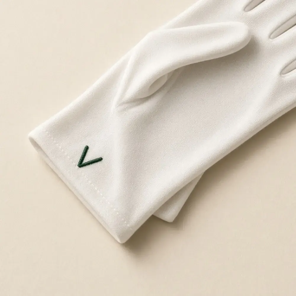 White glove cuff with green mark