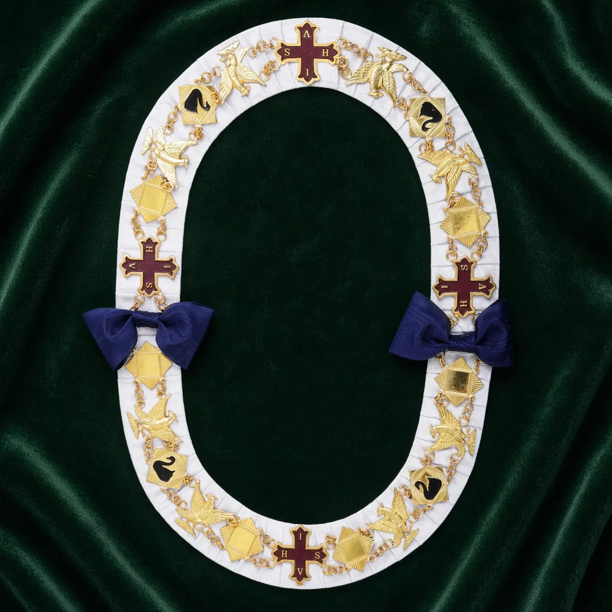 Gold chain collar with jewels on green velvet