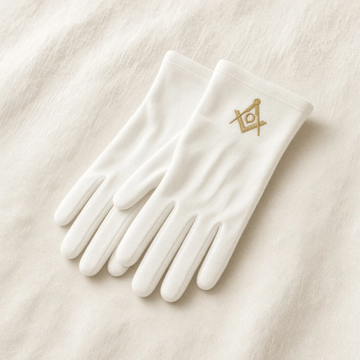 White gloves with gold square and compass